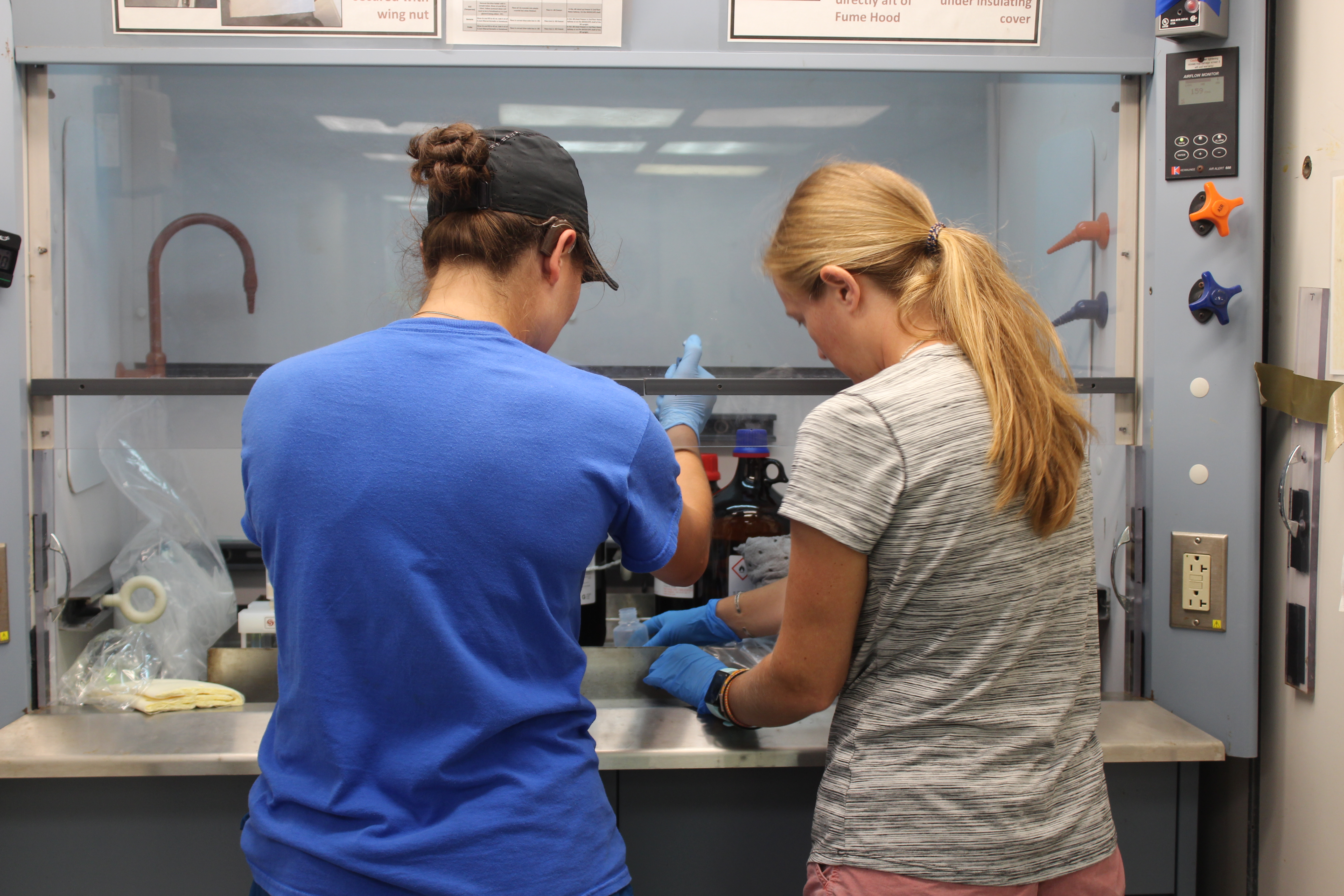 Maddy Lahm and Leanne Powers prepare their filters for the incoming water samples